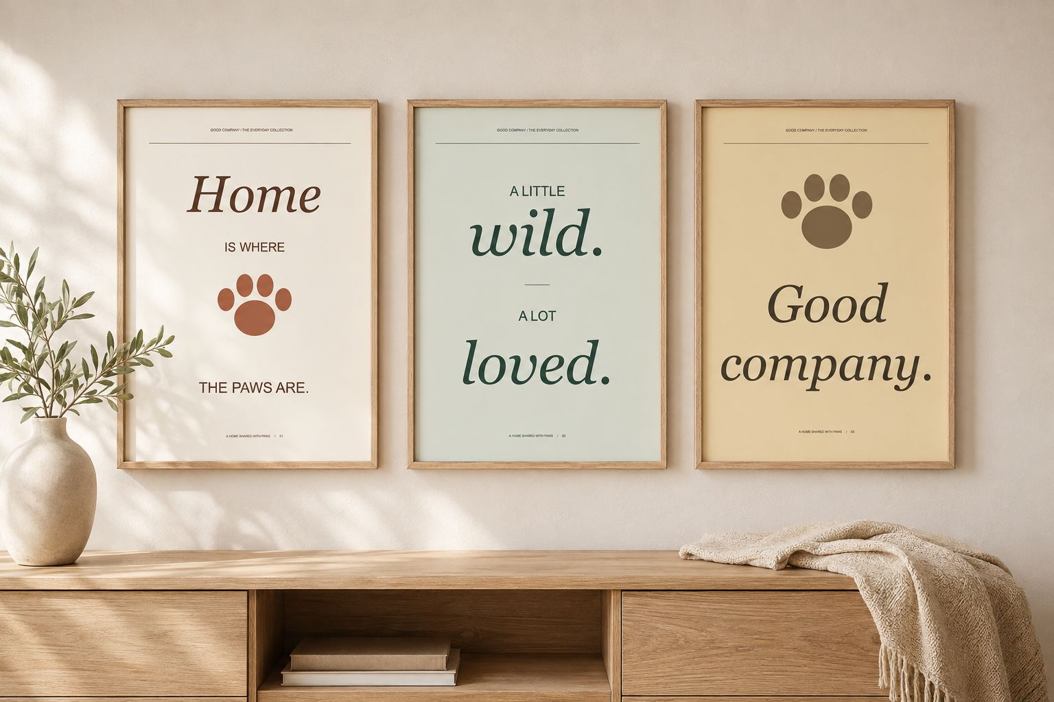 Illustrative room mockup of the three Good Company printable designs in oak frames